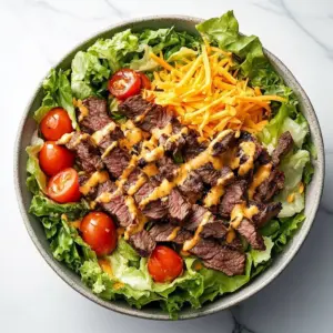 Big Mac Salad featuring fresh vegetables, beef, and creamy dressing