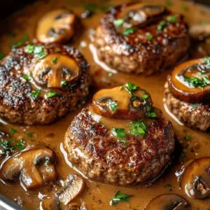 Classic Salisbury steak served with rich mushroom gravy on a plate