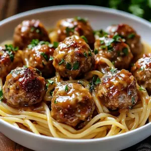 Creamy garlic butter meatballs in a rich sauce served on a plate