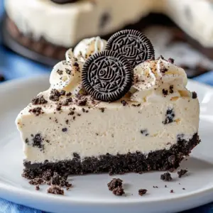 Fireworks Oreo No-Bake Cheesecake Bars with crushed Oreo cookies and cream