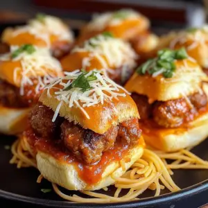 Mini spaghetti and meatball sliders served on a platter