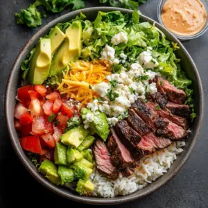 Delicious Sizzling Beef Bowls served hot with fresh vegetables and rice