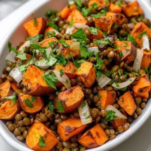 Zesty Lentil and Sweet Potato Salad in a vibrant bowl garnished with herbs